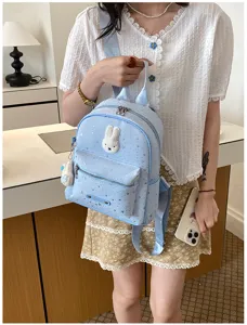 Chic light blue mini backpack with cute bunny patch and star print for stylish daily wear.