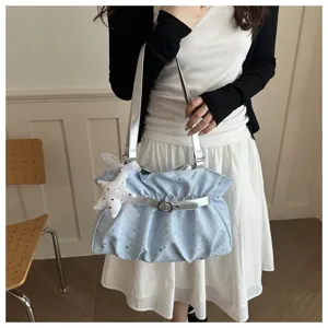 Light blue star pattern shoulder bag with silver straps and buckle, stylish casual handbag for women.