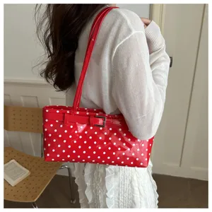 Red polka dot patent leather shoulder handbag for women, stylish casual tote bag.