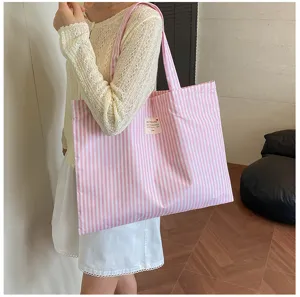 Rosa-weiße gestreifte Canvas-Tasche, große Kapazität, lässige Schultertasche für Schule und Pendeln