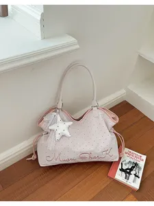 Pink polka dot tote bag for women, stylish shoulder bag with cute star lace pendant and handles.