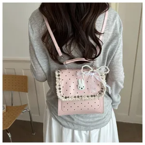 Pink polka dot backpack with cute rabbit applique, lace bow and pearls for women and students.