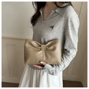 Detailed view of the stylish khaki bowknot clutch bag, perfect for daily commuting and chic looks.