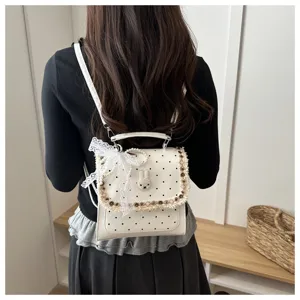 Cute white polka dot backpack with lace bow and rabbit detail, ideal for daily student school.