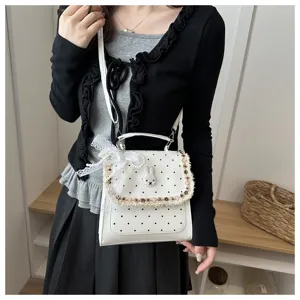 Korean style polka dot handbag with cute rabbit patch, lace bow and beaded fringe for women.