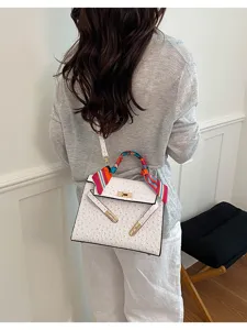 White ostrich pattern Kelly bag for women, stylish top handle shoulder crossbody bag daily use.