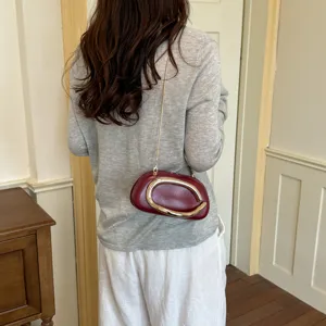 Stylish women's shoulder bag with metal ring design, casual chic fashion crossbody bag.