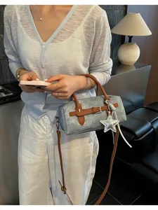 Vintage grey pillow handbag with brown straps and star pendant, elegant daily shoulder bag.