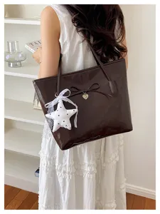 Vintage dark brown tote bag for women, elegant bow and star charm handbag, trendy commuter purse.