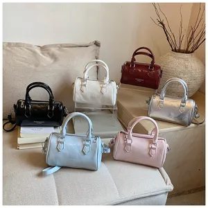 Boston handbag detail showing trendy color options with premium leather and metal zippers.