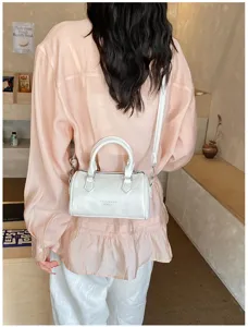 Women white Boston shoulder bag stylish casual crossbody pillow bag perfect for daily commute.