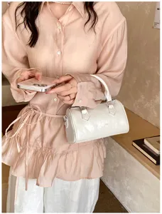 White leather Boston handbag for women, chic trendy crossbody shoulder bag for daily commuting style.