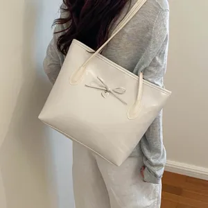 Women fashion glossy leather vintage tote bag, stylish bow shoulder crossbody handbag.