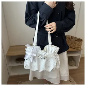 White women's shoulder bag with star print, cute lace star pendant and stylish buckle.