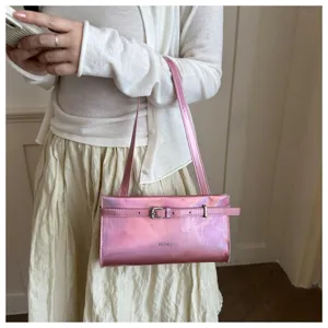 Detailed view of a shiny pink shoulder bag with a metal buckle and subtle strap design.