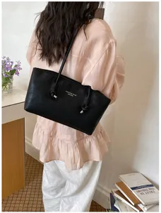 Minimalist black shoulder tote bag for women, large capacity retro commuter underarm handbag.