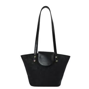 Minimalist black shoulder tote bag for women, chic bucket purse with flap and slim straps.