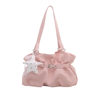 Pink star print shoulder bag for women, cute Y2K tote handbag with star pendant and buckle.