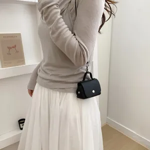 Stijlvolle vrouwen mini riemtas minimalistisch zwart leer compact tasje trendy mode stijl