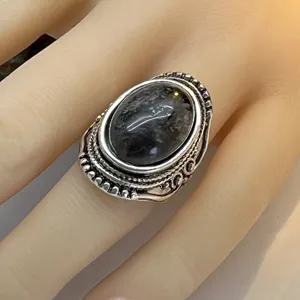 Vintage European American natural stone ring with ornate carved band ethnic style jewelry detail view