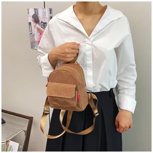 Brown plaid mini backpack for women, cute casual small school bag with top handle and pocket.
