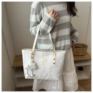 Casual white tote bag with cute cloud pendant, large capacity shoulder bag for daily commute.