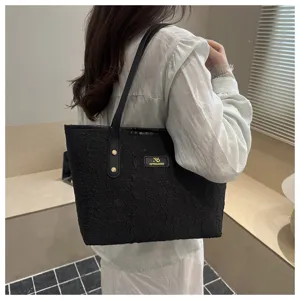 Stylish black tote bag for women, large capacity shoulder handbag for casual daily commute.