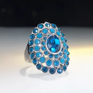Exaggerated crystal statement ring with vibrant blue rhinestones and silver-tone alloy base for women party wear