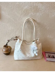 Stylish canvas shoulder tote bag with cute plush cloud pendant, spacious daily handbag.