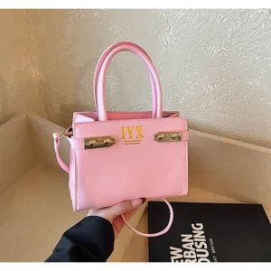 Pink PU leather top handle small square bag with metal buckle and shoulder strap for women.