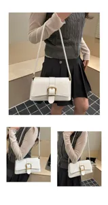 White patent leather shoulder bag for women, retro chic baguette handbag with gold buckle.
