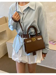 Fashion brown leather handbag for women, chic top handle shoulder crossbody bag daily use.