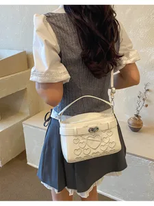 Stylish white embroidered shoulder bag with cute heart patterns for women, chic daily handbag.