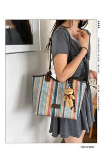 Fashion color-block woven tote bag for women, casual commuter handbag with cute bear pendant.