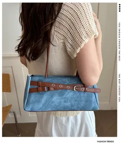 Stylish denim underarm shoulder bag with contrast belt and metal buckle for women daily wear.