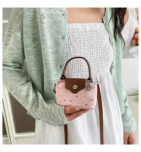 Mini pink star print denim crossbody bag with brown handle, trendy fashion casual handbag.