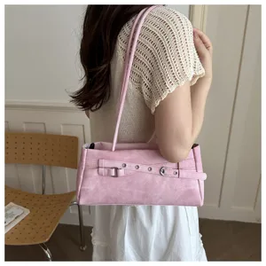Sweet pink shoulder underarm bag with stylish belt buckle design for women spring casual wear.