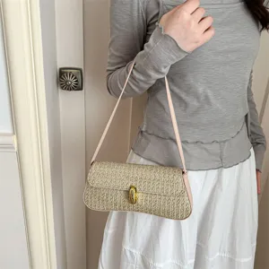 Korean style woven straw shoulder bag with metallic lock, elegant underarm bag for women.