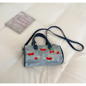 Denim Boston shoulder bag with cute cherry embroidery and pendant, casual everyday handbag.