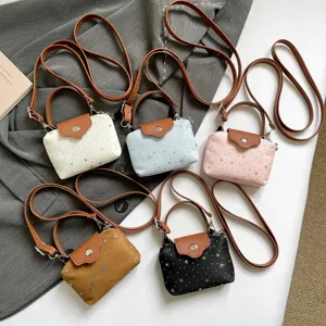 Small crossbody shoulder bag for women, cute star print canvas coin purse with handle.