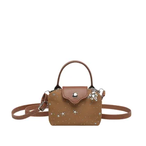 Brown denim mini dumpling bag with top handle, star studs, and cute flower charm.