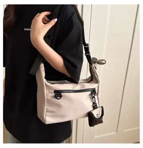 Casual nylon crossbody shoulder bag for women, trendy minimalist daily commuter bag.