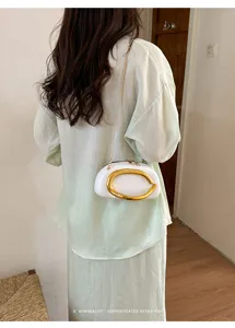 Mini retro white evening shoulder bag with gold chain strap and metal C handle for women.