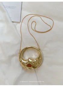 Stylish gold crescent moon metal chain mini crossbody bag, trendy retro lipstick handbag.