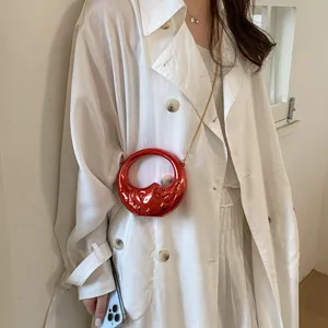 Stylish women red metallic mini chain crossbody bag, unique round handbag for daily wear.