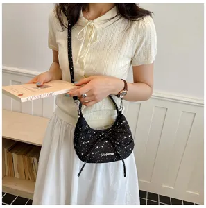Trendy black star print shoulder bag with cute bow design, perfect for daily casual outfits.