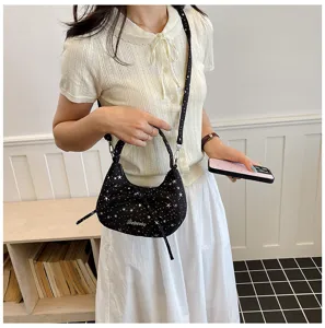 Stylish black star print canvas dumpling crossbody bag with cute bow and chic design for women.