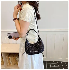 Detailed view of women's black star pattern dumpling shoulder bag with cute bow knot.