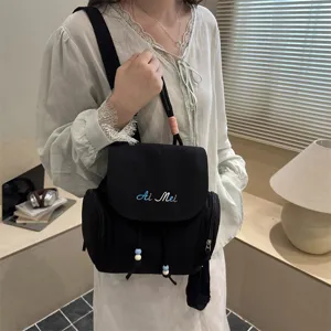 Mochila casual negra de lona para mujer, elegante bolso diario de gran capacidad para el trabajo.