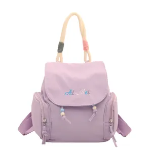 Mochila casual para mujer en morado claro elegante bolso escolar ligero y diario